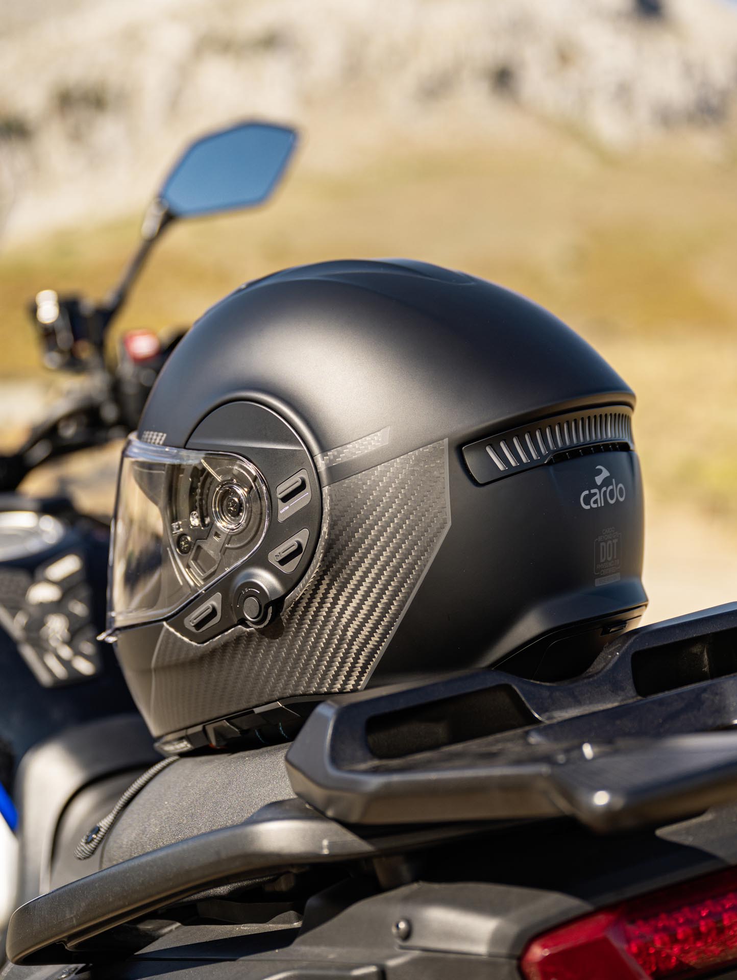 Rear view of the Cardo BEYOND GTS helmet demonstrating the integrated active brake light for safety.