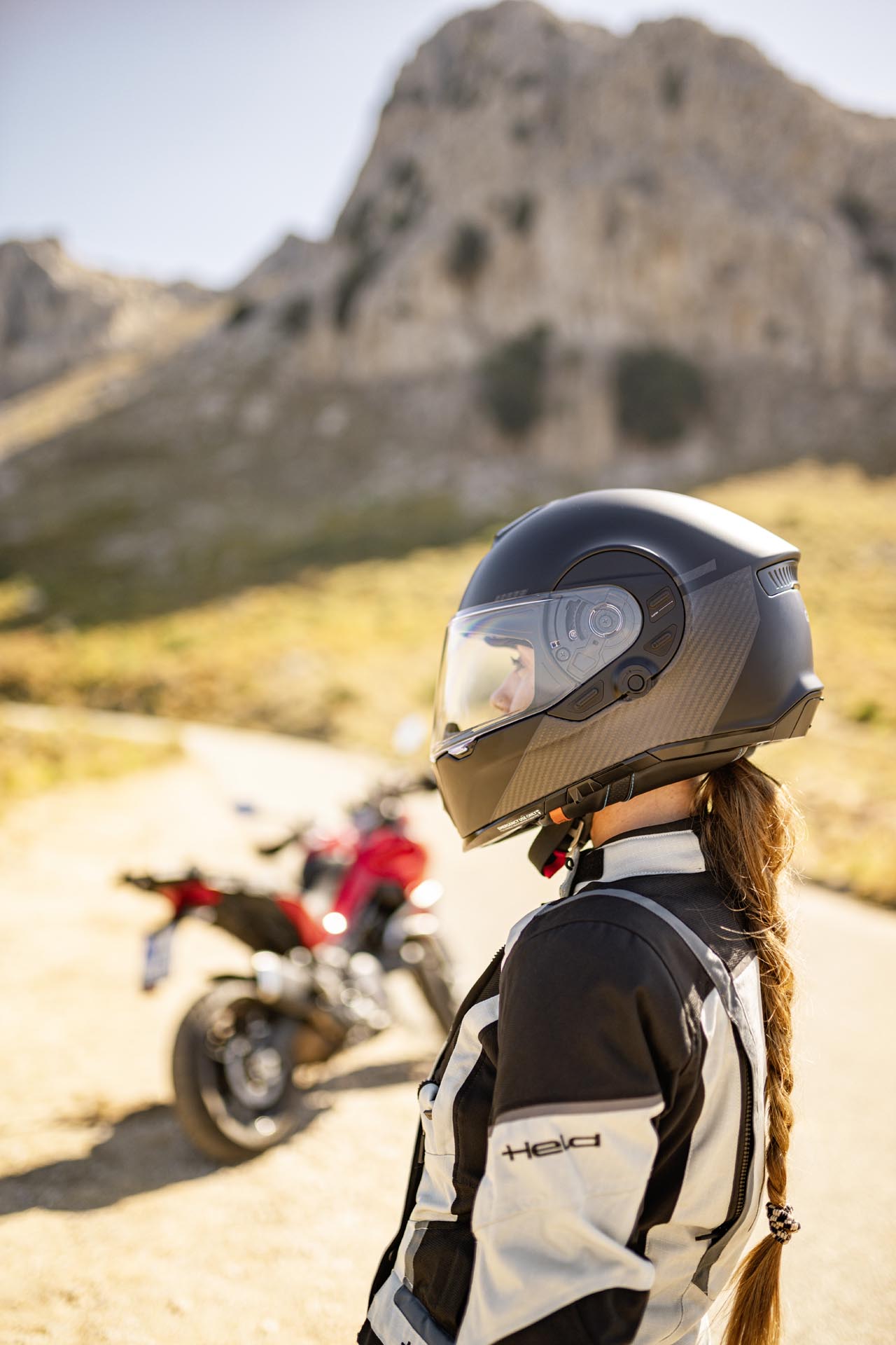 Rear view of the Cardo BEYOND GTS helmet demonstrating the integrated active brake light for safety.