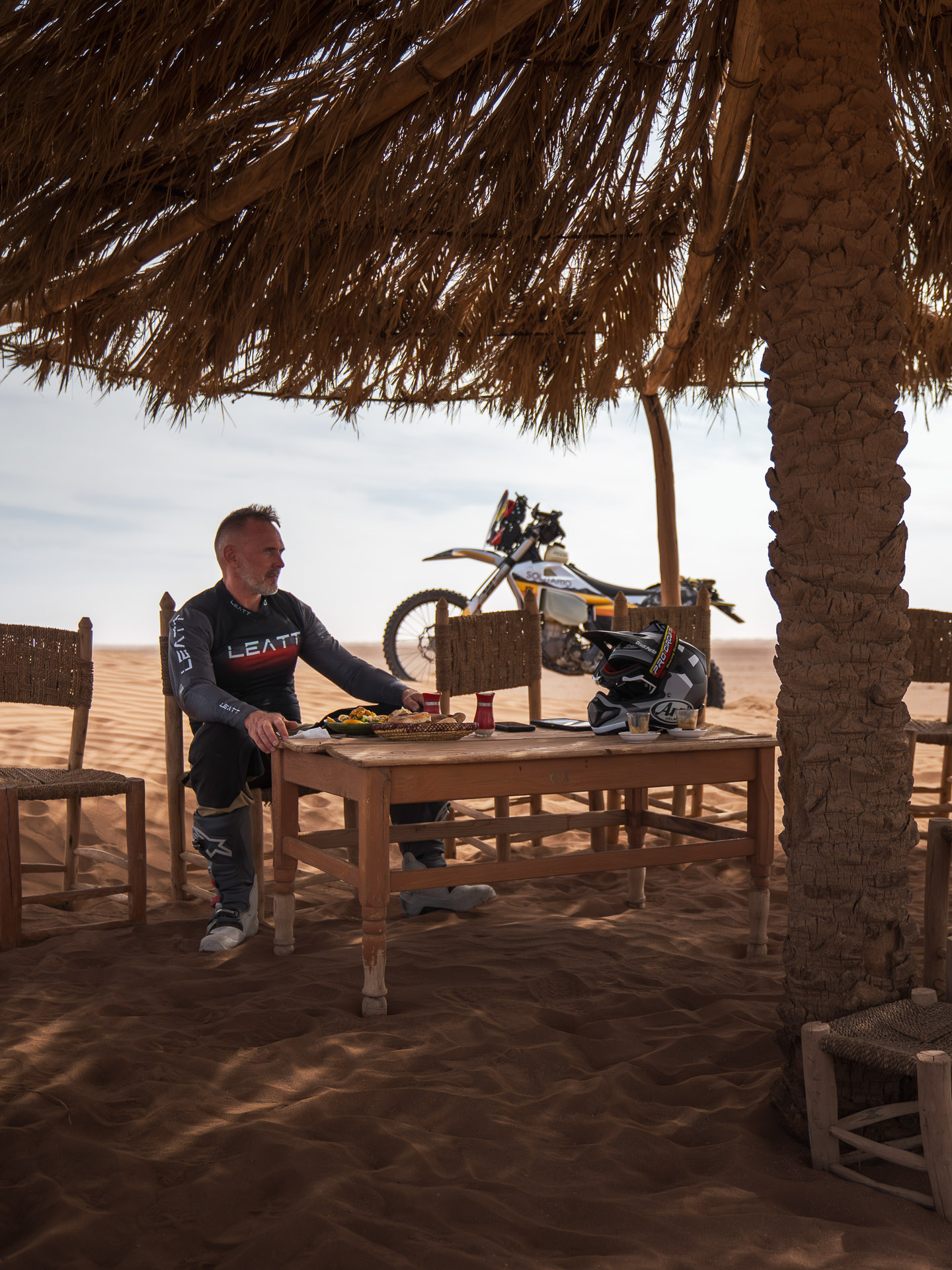 BMW R1250GS parked at a high-altitude fire lookout on an epic motorcycle travel route.